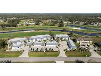 Scenic aerial view of the condo community overlooking a lush golf course and surrounding greenery at 1340 San Cristobal Ave # 304, Punta Gorda, FL 33983