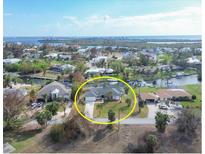 Waterfront property featuring a private boat dock and scenic views of the surrounding canals and coastline at 165 Spyglass Aly, Placida, FL 33946