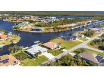 Aerial view of waterfront property and neighborhood at 15546 Viscount Cir, Port Charlotte, FL 33981