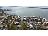 Aerial view of waterfront property with canal access at 701 W Perry St, Englewood, FL 34223