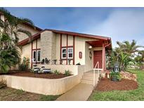 Inviting exterior with landscaping and charming architectural details at 93 Boundary Blvd # 301, Rotonda West, FL 33947