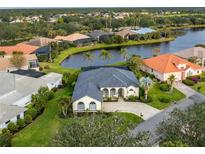 Aerial view of single-Gathering home community with water features at 3310 Bay Ridge Way, Port Charlotte, FL 33953