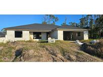 Newly constructed one-story home with a grey roof and block exterior at 5306 Jennings Blvd, Port Charlotte, FL 33981