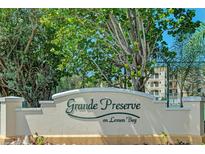 Grande Preserve on Lemon Bay community entrance sign with building in background at 9203 Griggs Rd # B302, Englewood, FL 34224