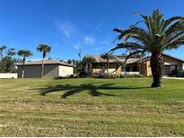 Spacious home with large yard and detached garage at 9822 Gulfstream Blvd, Englewood, FL 34224