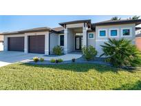 Front view of house with walkway and landscaping at 226 Rotonda N Blvd, Rotonda West, FL 33947