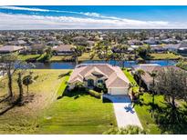 Single-Gathering home with water access, large backyard, and paved driveway at 241 Marker Rd, Rotonda West, FL 33947