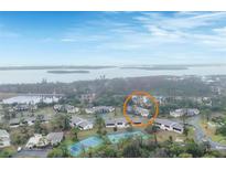 Aerial view showing the property and surrounding tennis courts at 4260 Placida Rd # 18C, Englewood, FL 34224