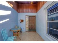 Inviting front entry with tiled floor, and small table with chairs at 610 Apple Ln, Englewood, FL 34223