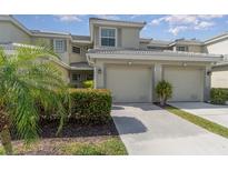 Attractive two-story condo with two-car garage and lush landscaping at 3353 Grand Vista Ct # 202, Port Charlotte, FL 33953