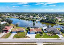 Aerial view of single-Gathering home with water access at 7398 Spinnaker Blvd, Englewood, FL 34224