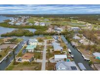 Aerial view of waterfront homes and community with golf course at 10451 Sherman St, Englewood, FL 34224