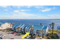 Aerial view of waterfront condo building, showing unit location and parking at 4410 Warren Ave # 403, Port Charlotte, FL 33953