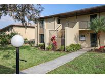 Inviting two-story condo with beautiful landscaping, walkways, and a well-maintained facade at 4072 Oakview Dr # C8, Punta Gorda, FL 33980