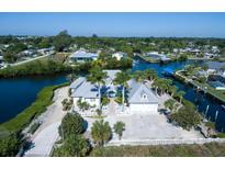 Waterfront home with private dock and lush landscaping at 1112 Andrews St, Englewood, FL 34224