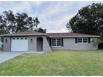 Updated single story home with new landscaping and a large yard at 7848 Teal Dr, New Port Richey, FL 34653