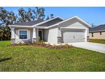 Charming single-Gathering home with a well-manicured lawn and neutral gray paint at 2614 58Th E Cir, Palmetto, FL 34221