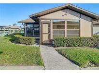 Inviting exterior with a well-maintained lawn and walkway at 4531 Blossom Blvd # 4531, Zephyrhills, FL 33542
