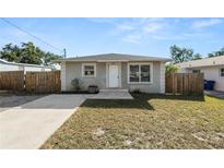 Charming single-story home with a well-maintained lawn and a quaint front entrance at 3415 N 53Rd St, Tampa, FL 33619