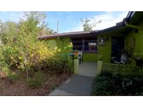 Green house exterior with walkway and landscaping at 231 Victoria Rd, Venice, FL 34293