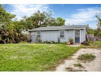 Quaint single-story home with a well-maintained lawn at 2191 Park Rd, Venice, FL 34293