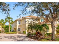 Attractive three-story home with a two-car garage and lush landscaping at 9607 Sea Turtle Ter # 101, Bradenton, FL 34212