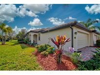Beautiful home with landscaped yard and two-car garage at 20272 Tesoro Dr, Venice, FL 34293