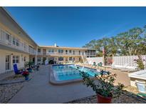 Inviting community pool with surrounding patio at 509 W Venice Ave # 109, Venice, FL 34285