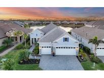 Luxury home with lake view in a gated community at 13072 Steinhatchee Loop, Venice, FL 34293