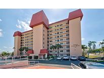 Condo building with red roof, ample parking, and a desirable location at 244 Saint Augustine Ave # 805, Venice, FL 34285