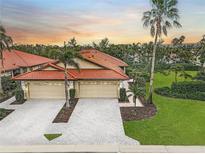Two-car garage, paver driveway, landscaped yard, inviting curb appeal at 4575 Cancello Grande Ave, Venice, FL 34293