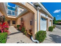Inviting exterior with walkway, landscaping, and attached garage at 1006 Gondola Park Dr # 1006, Venice, FL 34292