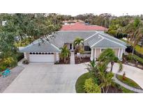 Attractive single-story home with a large driveway and landscaped yard at 315 Park N Blvd, Venice, FL 34285