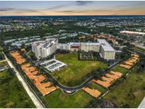 Aerial view of a large community with multiple buildings and landscaped grounds at 3730 Cadbury Cir # 300, Venice, FL 34293