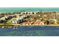 Aerial view of waterfront property with private docks and stunning water views at 2985 N Beach Rd # C8-1, Englewood, FL 34223