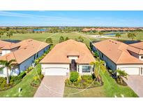 Luxury home with tile roof and attached garage, desirable location at 25064 Spartina Dr, Venice, FL 34293
