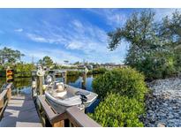 Private boat dock with covered slip and access to the water at 1985 Fairview Dr, Englewood, FL 34223