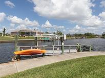 Private dock with kayak and beautiful water views at 335 Englewood Isles Pkwy # 55, Englewood, FL 34223