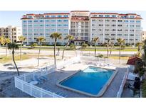 Communal swimming pool with surrounding lounge area at 500 The Esplanade N # 306, Venice, FL 34285