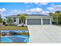 Inviting home featuring a spacious three-car garage and beautiful landscaping, including palm trees and a private backyard court at 14098 Baracoa Ln, Port Charlotte, FL 33981