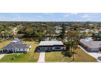 Aerial view of the property with a beautiful waterfront, showcasing the surrounding neighborhood at 3560 Middletown St, Port Charlotte, FL 33952