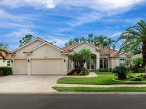 Stunning home exterior with a two-car garage at 5031 Bella Terra Dr, Venice, FL 34293
