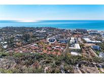 Aerial view of a condo community near the ocean, highlighting a specific unit at 110 Vista Hermosa Cir # 102B, Sarasota, FL 34242
