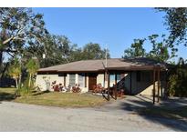 Single story home with carport and landscaping at 451 Home Park Rd, Venice, FL 34285