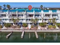 Aerial view of waterfront property with private docks at 8230 Harborside Cir, Englewood, FL 34224