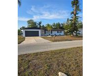 Charming single-story home with well-maintained lawn, two-car garage, and beautiful stone accents at 3014 W Southern Pkwy, Bradenton, FL 34205