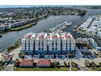 Luxury waterfront condos boast red tile roofs, bay views, and a private marina with easy access to the open water at 501 Tamiami N Trl # 502, Venice, FL 34285