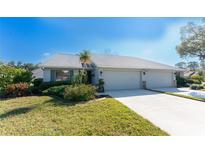 Charming single-story home featuring a well-maintained lawn and a spacious three-car garage at 446 Pendleton Ct, Venice, FL 34292