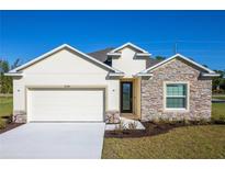 Craftsman style home with stone accents and a two-car garage at 25388 Alicante Dr, Punta Gorda, FL 33955