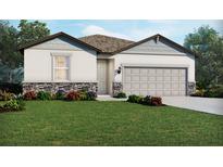 One-story home with gray siding, stone accents, and a two-car garage at 494 Sun Chaser Dr, Nokomis, FL 34275